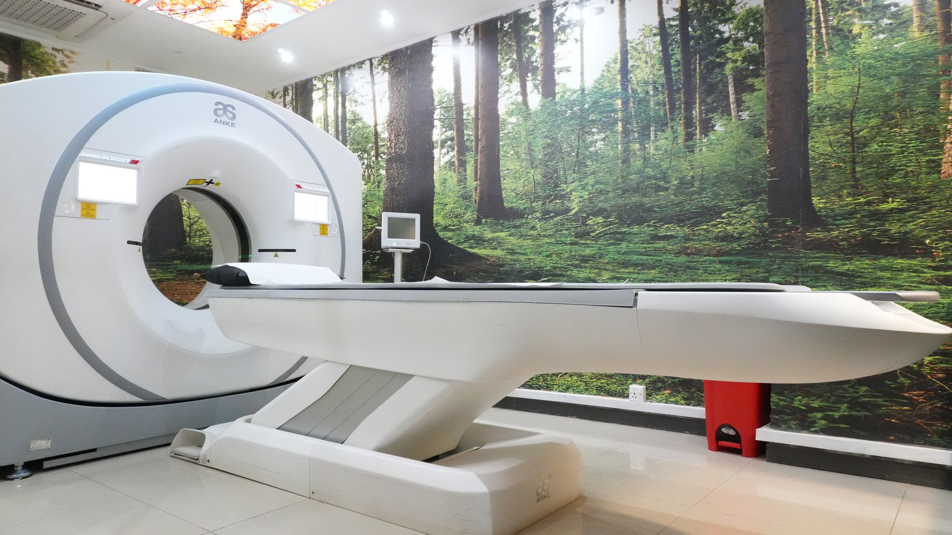 128-slice CT scanner gantry and examination room at Rayhaan Healthcare