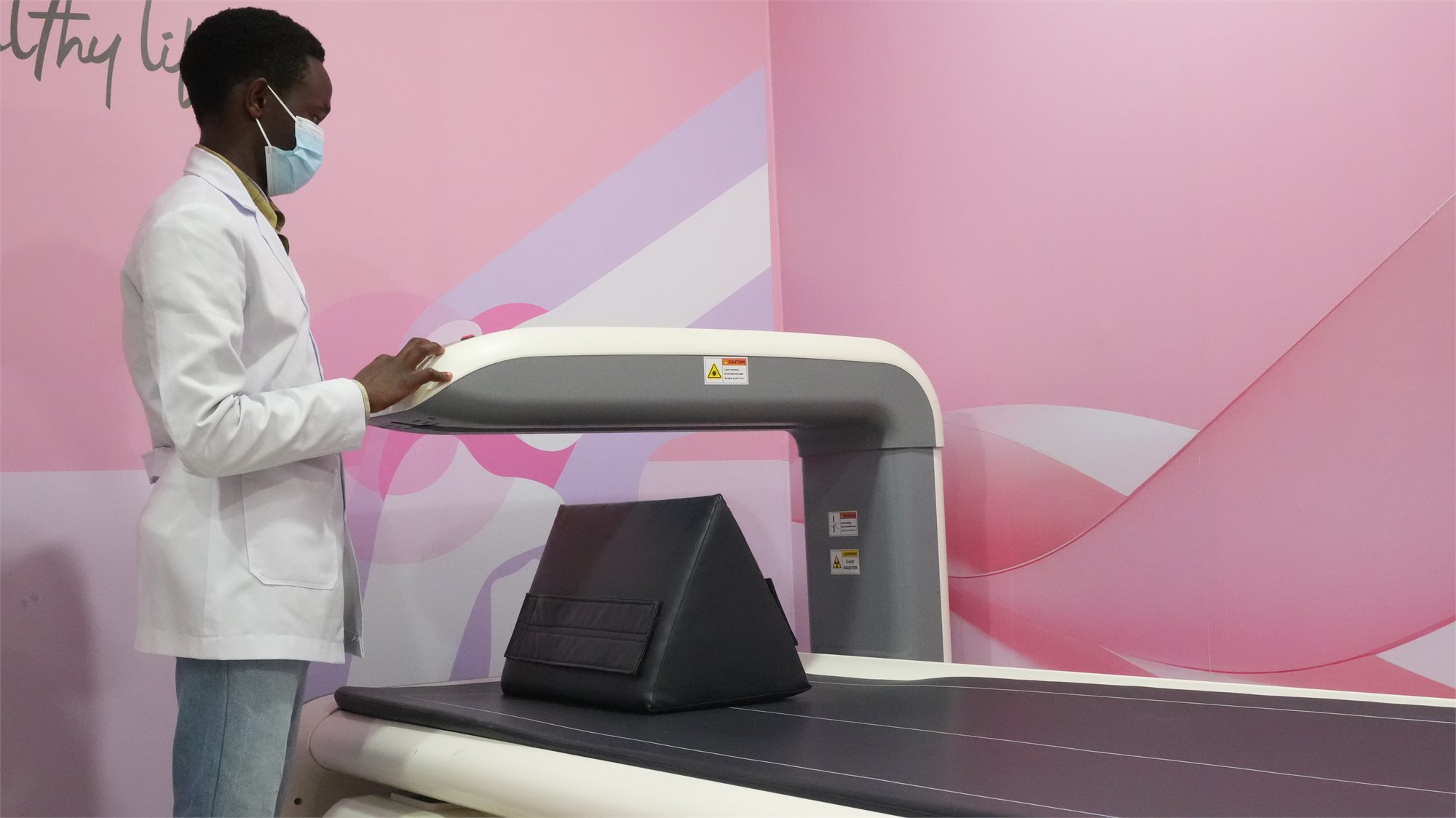 Rayhaan Healthcare technologist operating Bone DEXA equipment