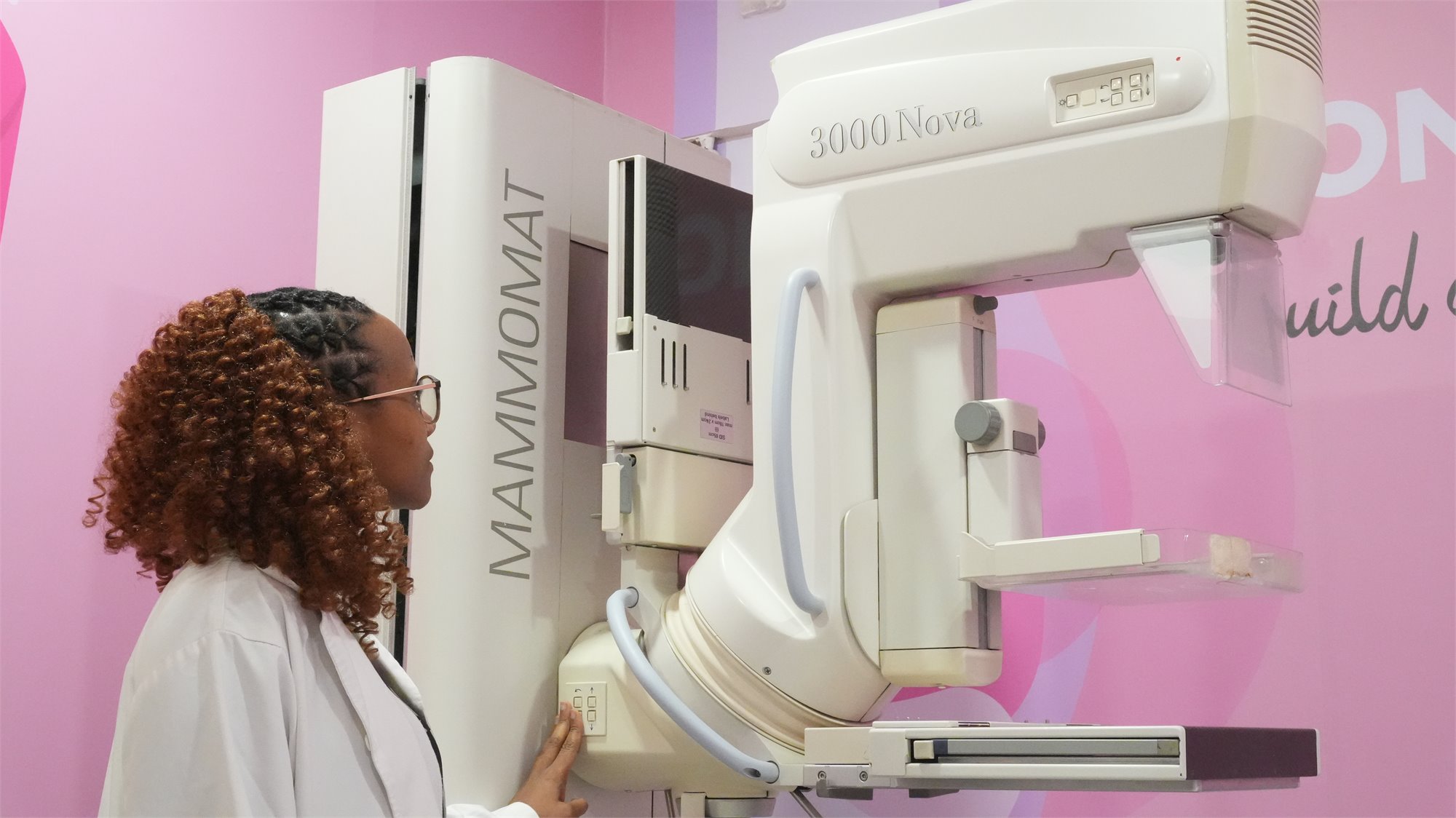 Rayhaan Healthcare mammography technologist with the mammogram system
